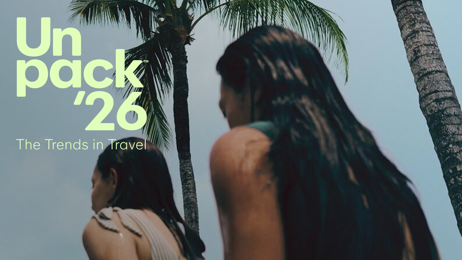 People standing under palm trees with “Unpack ‘26 The Trends in Travel” text overlay