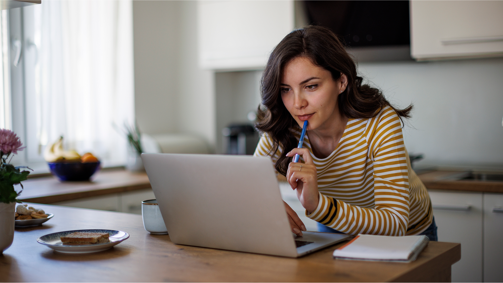 A young woman looking for travel offers on his computer